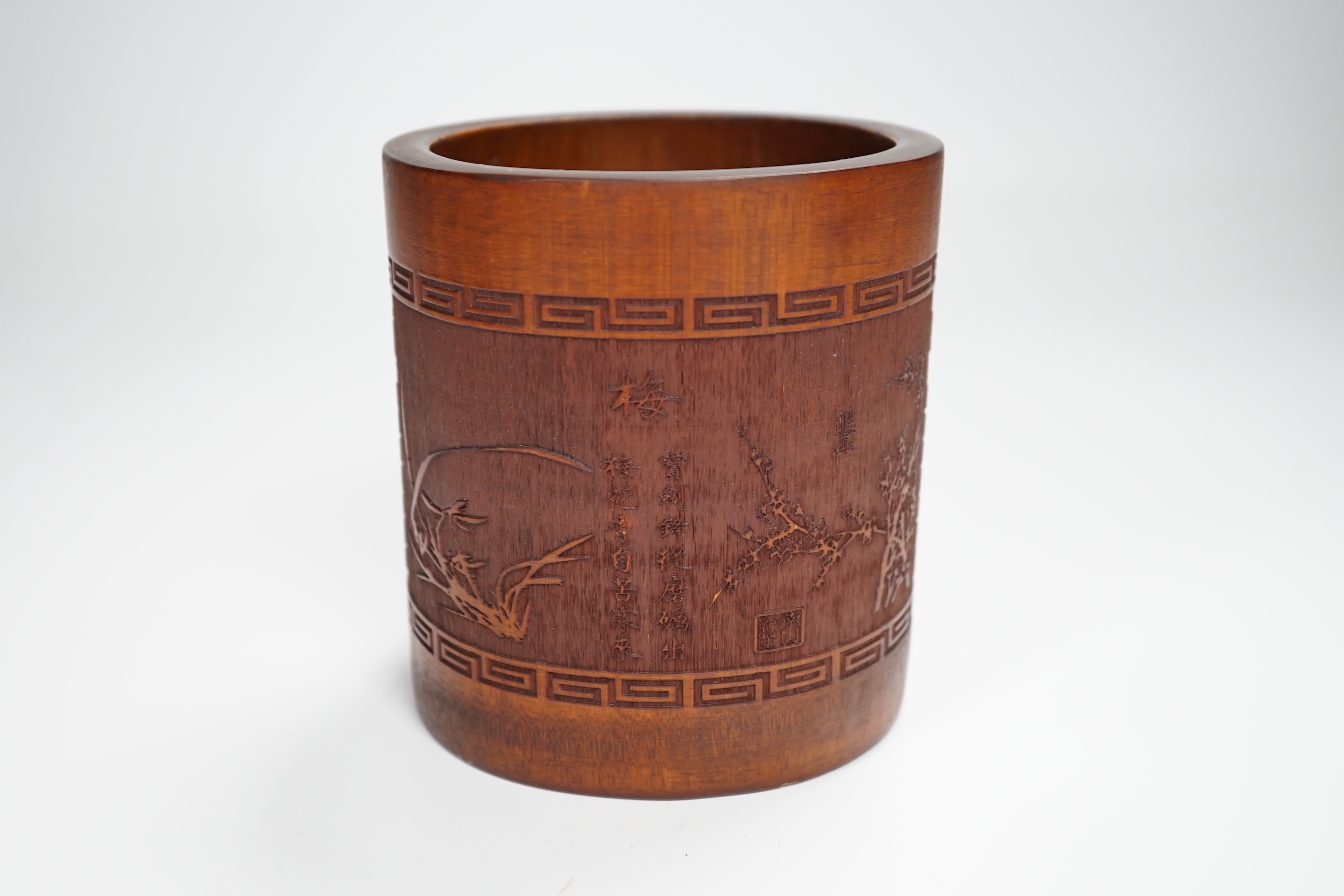 A 20th century bamboo bitong, carved with Chinese characters, bamboo and other foliage, 11.5cm high